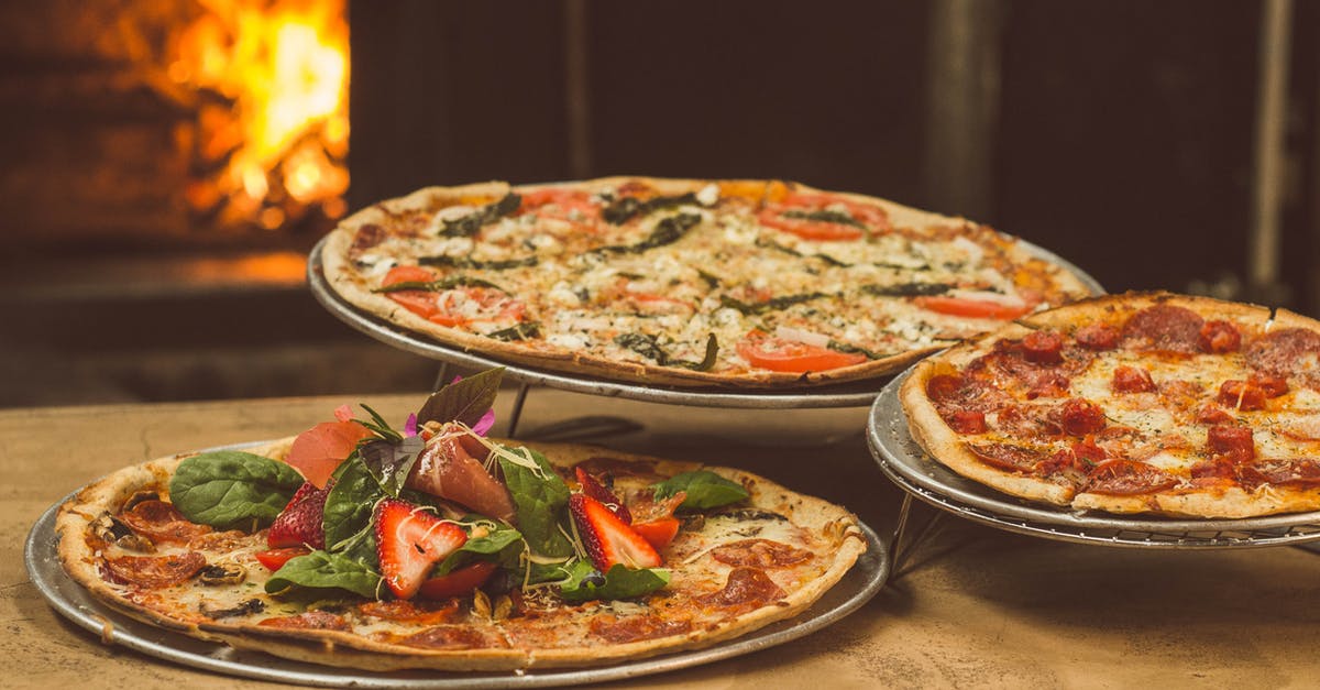 Should an oven be left to cool if cooking at a lower temperature? - Shallow Focus Photography of Several Pizzas