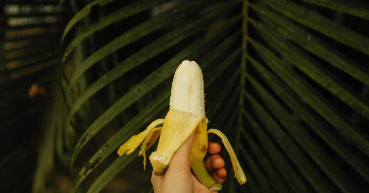 Should Chorizo Be Peeled Before Cooking? - Person Holding Peeled Banana