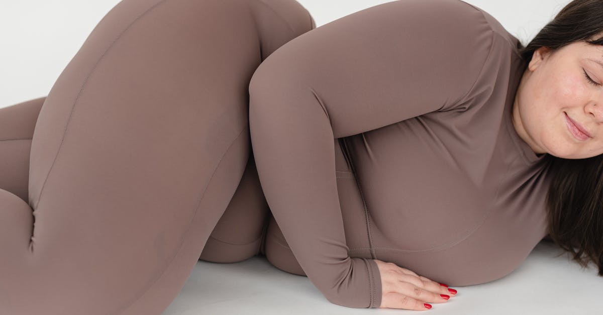 Should eggnog be chunky? - Smiling woman in activewear lying on floor in studio Should eggnog be chunky? - Smiling woman in activewear lying on floor in studio