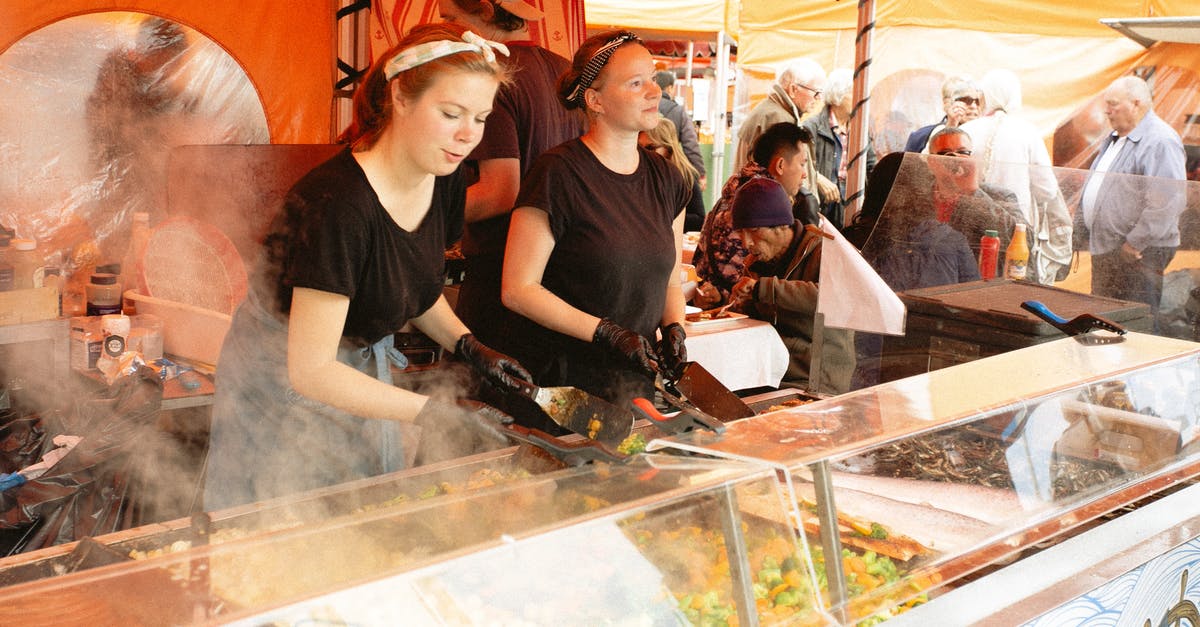 Should I cover food while reheating it in a microwave? - Women in Black Shirt Selling Food in Food Stall Should I cover food while reheating it in a microwave? - Women in Black Shirt Selling Food in Food Stall