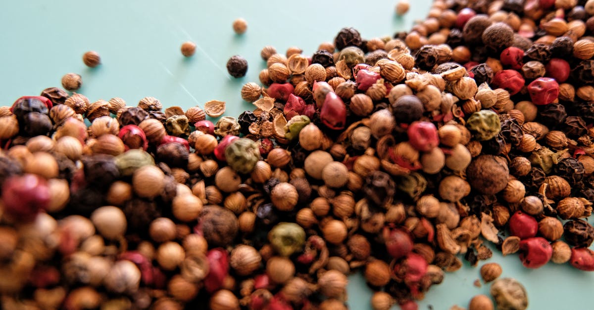Should I crush the spice for Chai Tea Latte? - From above heap of assorted dried berries and herbs for traditional tea scattered on white table Should I crush the spice for Chai Tea Latte? - From above heap of assorted dried berries and herbs for traditional tea scattered on white table