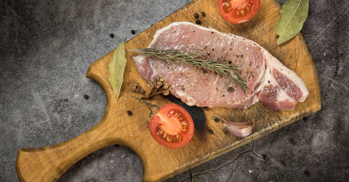 Should I marinate or dry-brine a steak first? - Sliced Tomatoes and Marinated Pork Meat on Brown Wooden Chopping Board Should I marinate or dry-brine a steak first? - Sliced Tomatoes and Marinated Pork Meat on Brown Wooden Chopping Board