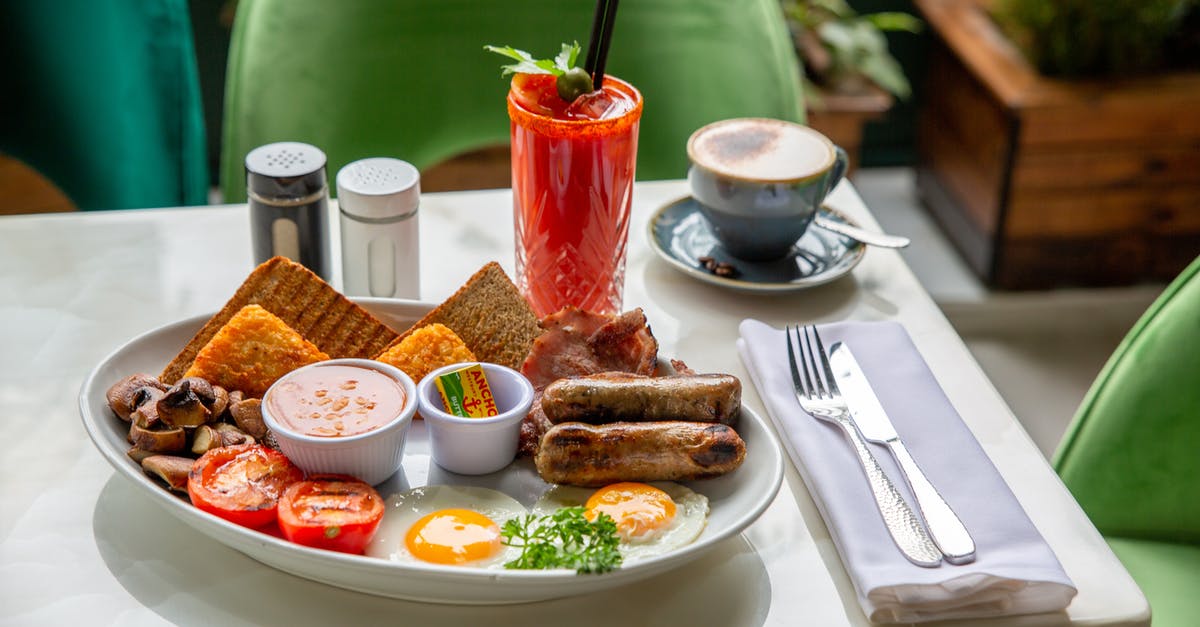 Should I pre-cook sausages before scrambling into eggs? - Grilled Sausages and Toasts on Plate Should I pre-cook sausages before scrambling into eggs? - Grilled Sausages and Toasts on Plate