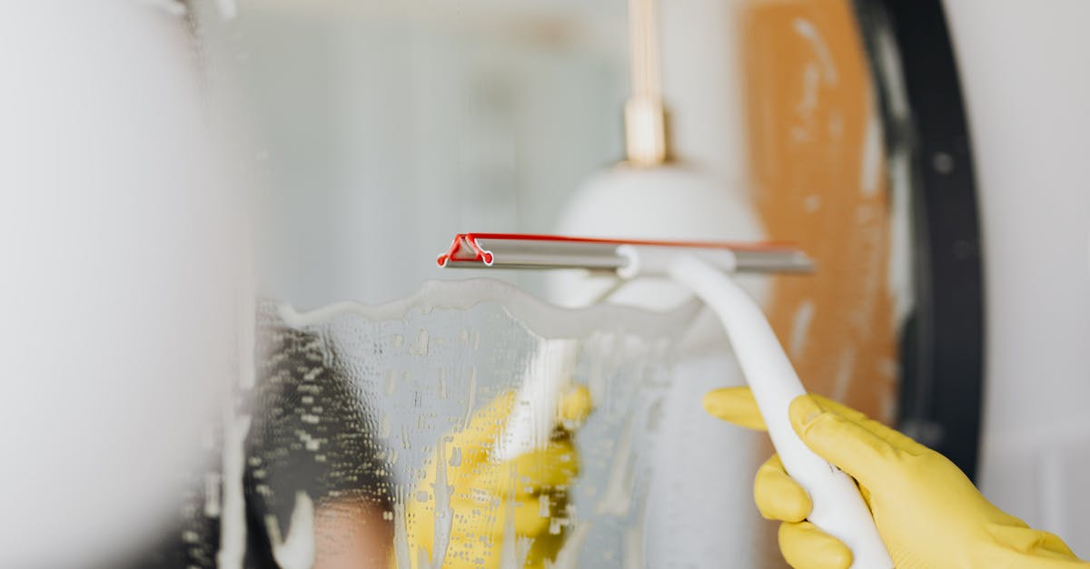 Should I remove the foam when cooking chickpeas? - Faceless person removing water from mirror