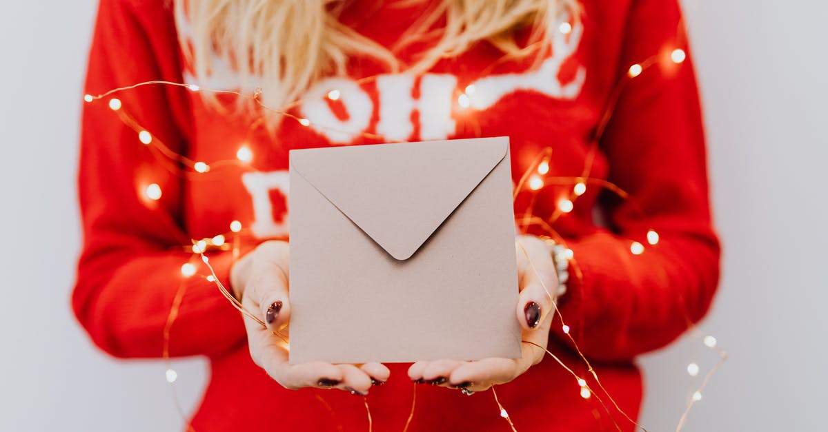 Should I season my paellera? - Woman in Red Long Sleeve Shirt Holding White Box