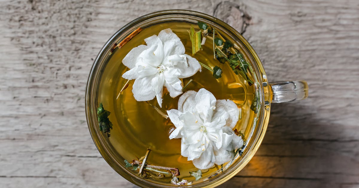 Should I use dried or fresh chilli/ginger in chai tea? - From above of aromatic herbal tea with fresh Arabian jasmine flowers in glass cup placed on wooden table in daylight Should I use dried or fresh chilli/ginger in chai tea? - From above of aromatic herbal tea with fresh Arabian jasmine flowers in glass cup placed on wooden table in daylight
