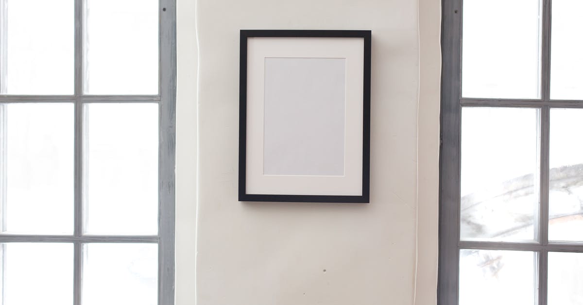 should new cast iron have flat smooth bottom - Interior of simple apartment with blank frame on white wall between rectangular shaped windows should new cast iron have flat smooth bottom - Interior of simple apartment with blank frame on white wall between rectangular shaped windows