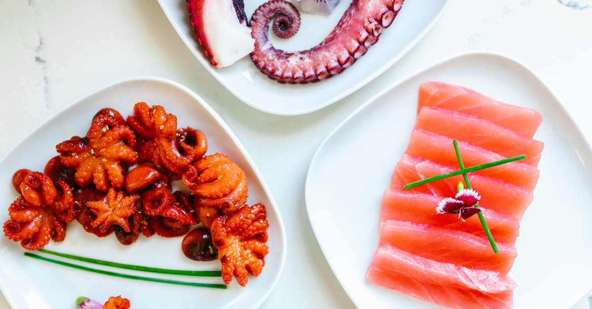 Should octopus be cooked twice? - Salmon and Octopus and Tentacles on Plates Should octopus be cooked twice? - Salmon and Octopus and Tentacles on Plates
