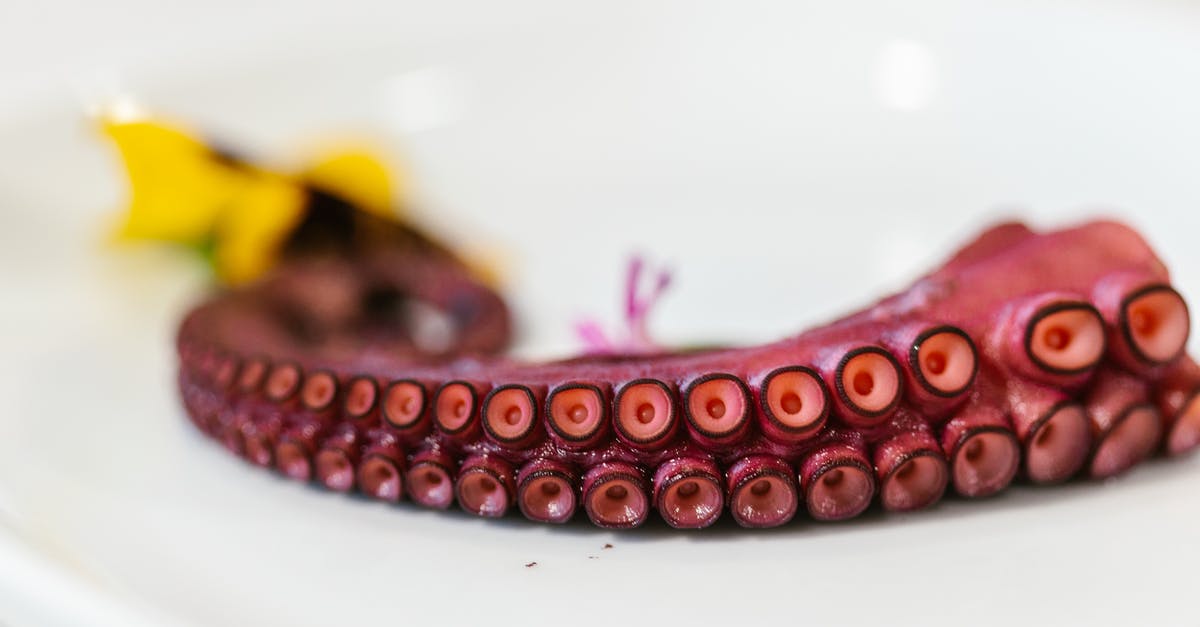 Should octopus be cooked twice? - Octopus Arm Served on White Plate Should octopus be cooked twice? - Octopus Arm Served on White Plate