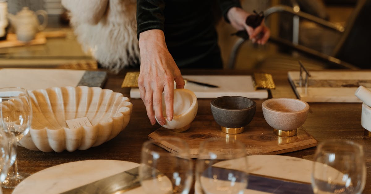 Should you store cutlery upside down? - A Customer Holding a Bowl Should you store cutlery upside down? - A Customer Holding a Bowl