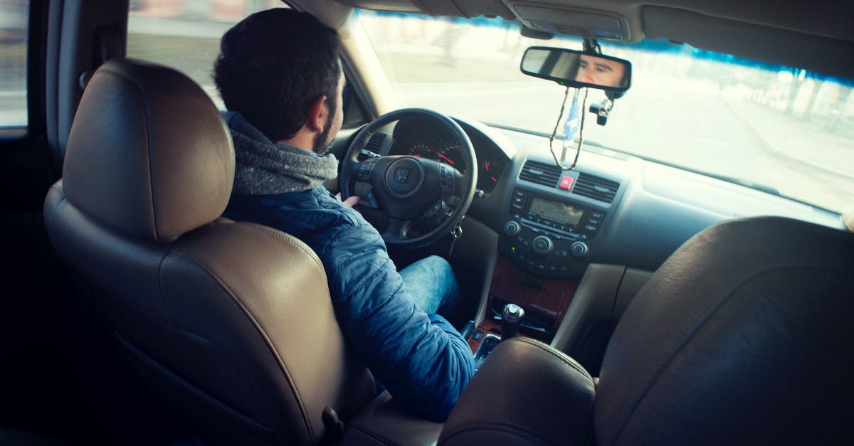 Shoulder Steak vs London Broil - Man Wearing Blue Jacket Sitting Inside Car While Driving Shoulder Steak vs London Broil - Man Wearing Blue Jacket Sitting Inside Car While Driving