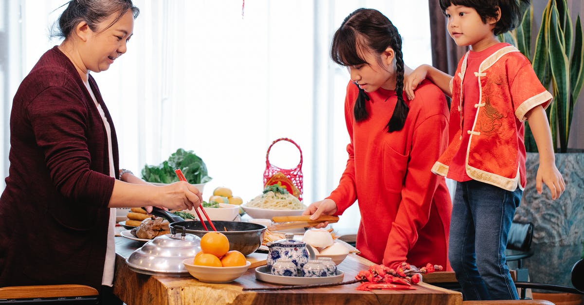 Shredded steak for south east asian dish - Smiling Asian old woman cooking Chinese food for event Shredded steak for south east asian dish - Smiling Asian old woman cooking Chinese food for event