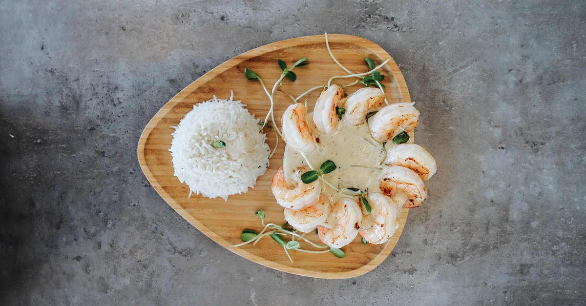 Shrimp/Fish Paste with rice - Brown Wooden Round Plate With White and Green Flowers Shrimp/Fish Paste with rice - Brown Wooden Round Plate With White and Green Flowers