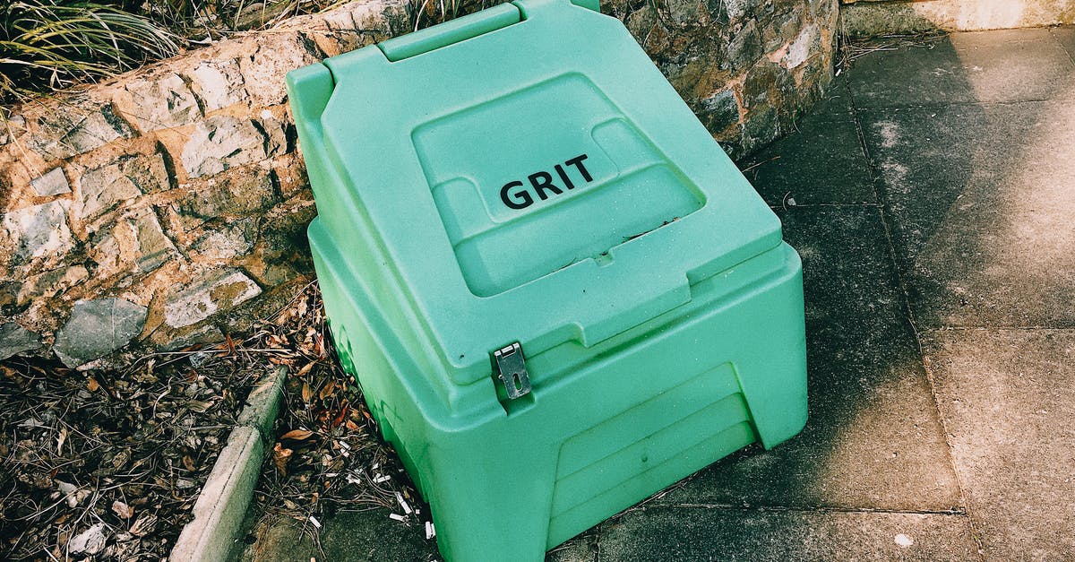 Simple stone ground flour bread - Container near stone barrier on street