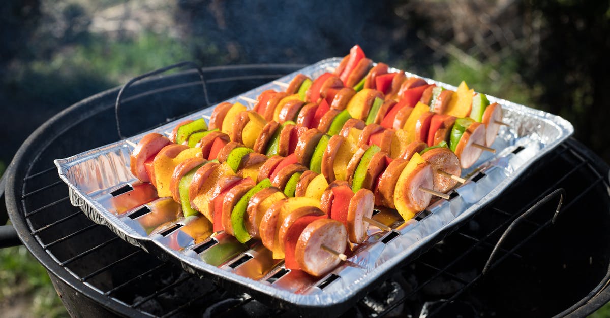 Slicing bratwurst for quicker, more even grilling - Slices of Sausages with Peppers Grilling Slicing bratwurst for quicker, more even grilling - Slices of Sausages with Peppers Grilling