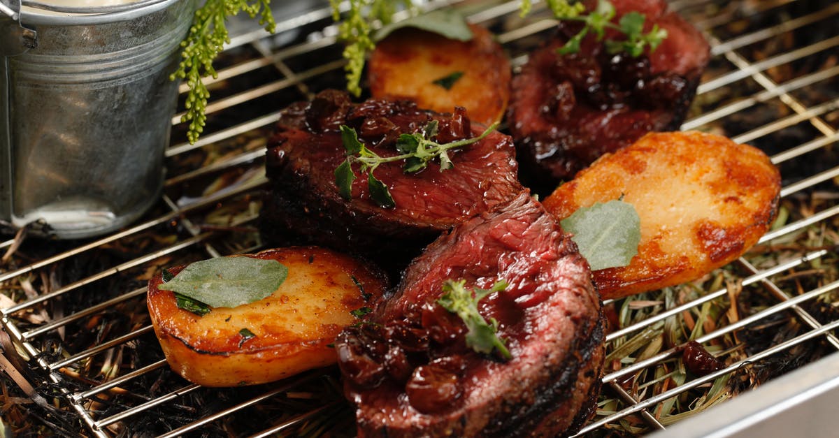 Slow roasting potatoes - Photograph of Roasted Beef with Potatoes Slow roasting potatoes - Photograph of Roasted Beef with Potatoes