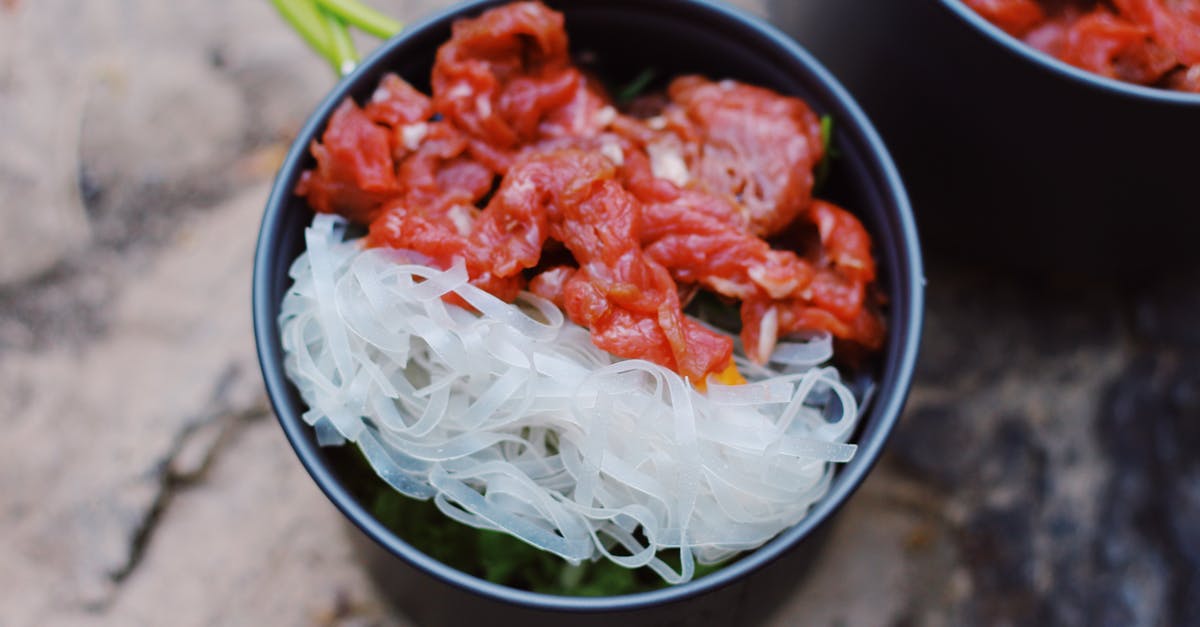 Slow-roasting top round beef - Bowl with rice noodles and meat Slow-roasting top round beef - Bowl with rice noodles and meat