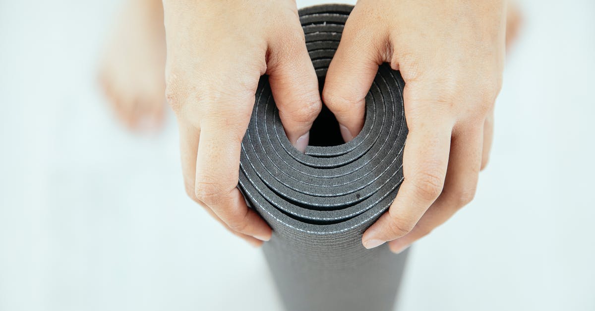 Slow-roasting top round beef - Top view of crop unrecognizable female holding gray rolled yoga mat placed in vertical position Slow-roasting top round beef - Top view of crop unrecognizable female holding gray rolled yoga mat placed in vertical position