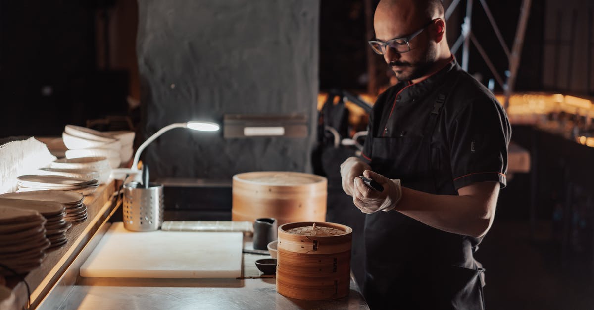 Smart idea to buy the woks that Chinese restaurant chefs use, for my home's electric induction cook top? - Man in Black Chef Shirt Holding Knife Beside Table Smart idea to buy the woks that Chinese restaurant chefs use, for my home's electric induction cook top? - Man in Black Chef Shirt Holding Knife Beside Table