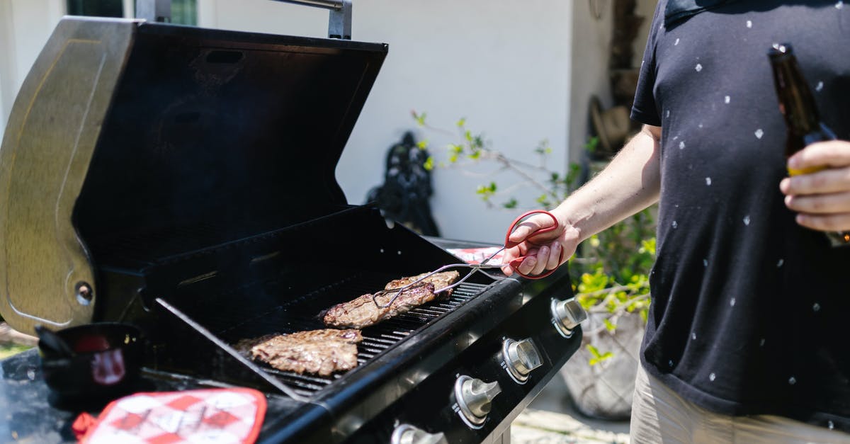 Smoked meat too smokey tasting - A Person in Black Shirt Cooking Meat while Using Tongs Smoked meat too smokey tasting - A Person in Black Shirt Cooking Meat while Using Tongs