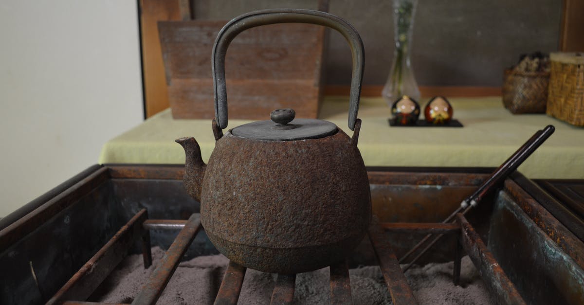 Smoking in Kettle Grill - Photo of a Rusty Kettle on the Grill Smoking in Kettle Grill - Photo of a Rusty Kettle on the Grill