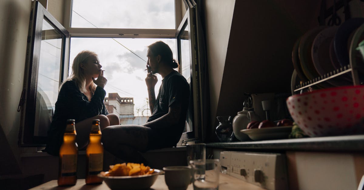 Smoking with chips after sous vide - Woman in Black Long Sleeve Shirt Sitting Beside Woman in Black Long Sleeve Shirt Smoking with chips after sous vide - Woman in Black Long Sleeve Shirt Sitting Beside Woman in Black Long Sleeve Shirt