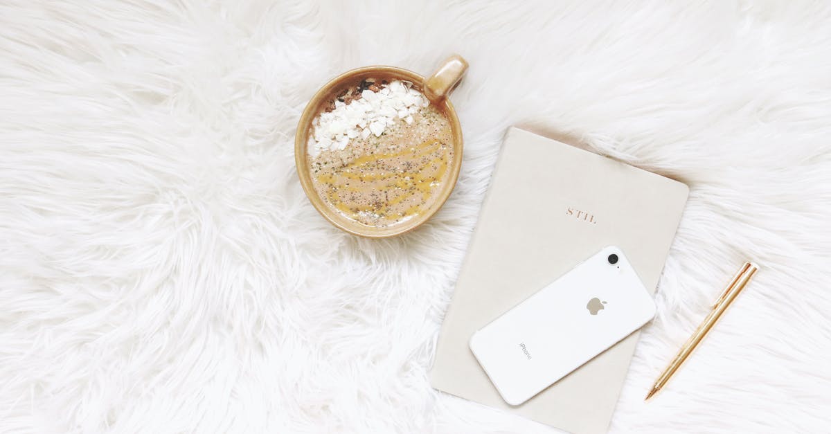 Smoothie amount decreases - White Iphone, Gold-colored Pen, and Round Gold-colored Cup Smoothie amount decreases - White Iphone, Gold-colored Pen, and Round Gold-colored Cup