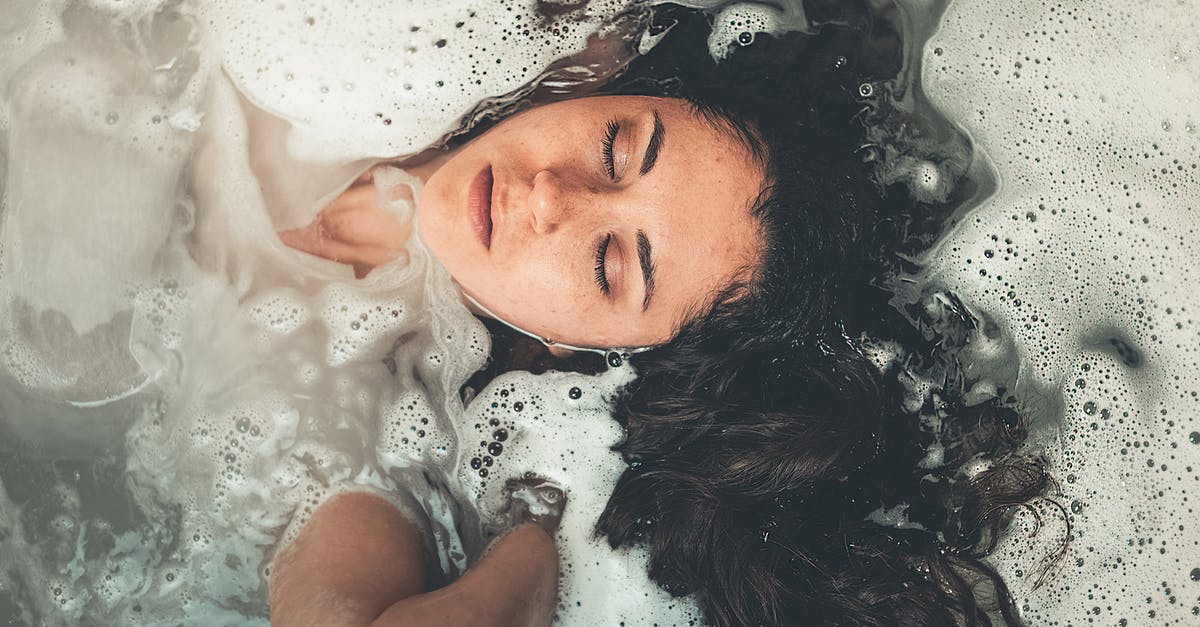 Soaking beef in water - Woman Soaked in Water With Bubbles Soaking beef in water - Woman Soaked in Water With Bubbles