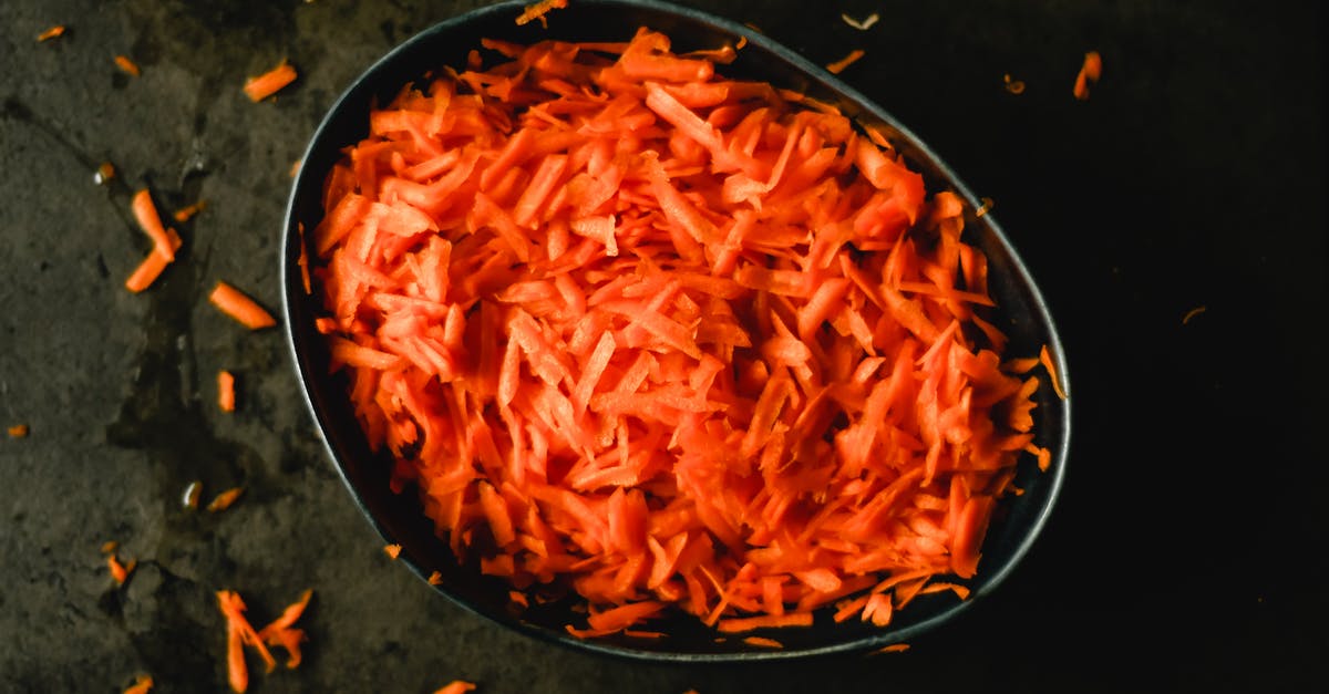 Some minor changes in recipe: Is it okay to use carrot marmalade instead of orange? - Heap of orange fresh grated carrot in baking pan Some minor changes in recipe: Is it okay to use carrot marmalade instead of orange? - Heap of orange fresh grated carrot in baking pan