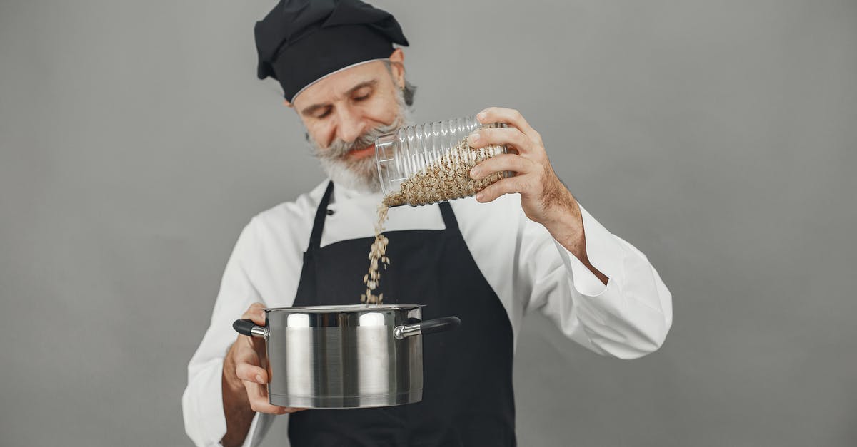 Something came out of oats. What's this? - Man in White Dress Shirt Holding Stainless Steel Cup Something came out of oats. What's this? - Man in White Dress Shirt Holding Stainless Steel Cup