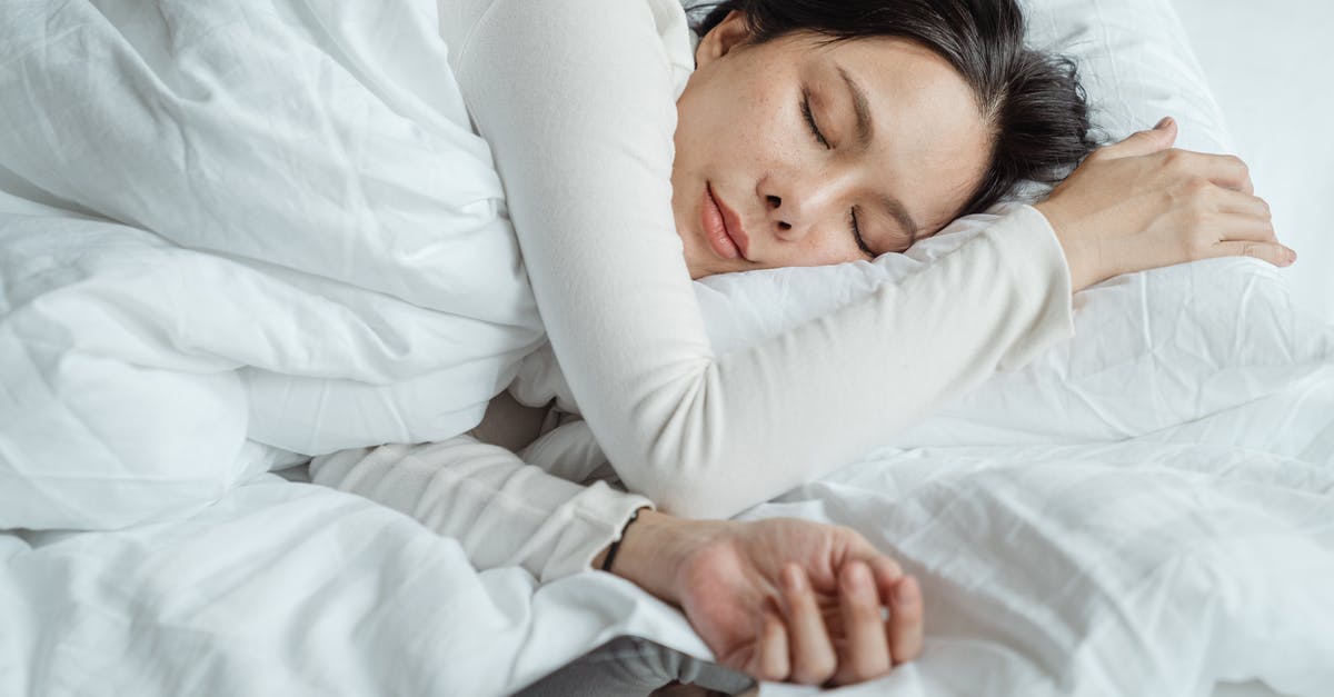 Sourdough starter used too early - Calm Asian female wearing white pajama sleeping in comfortable bed with white sheets near modern mobile phone in morning Sourdough starter used too early - Calm Asian female wearing white pajama sleeping in comfortable bed with white sheets near modern mobile phone in morning