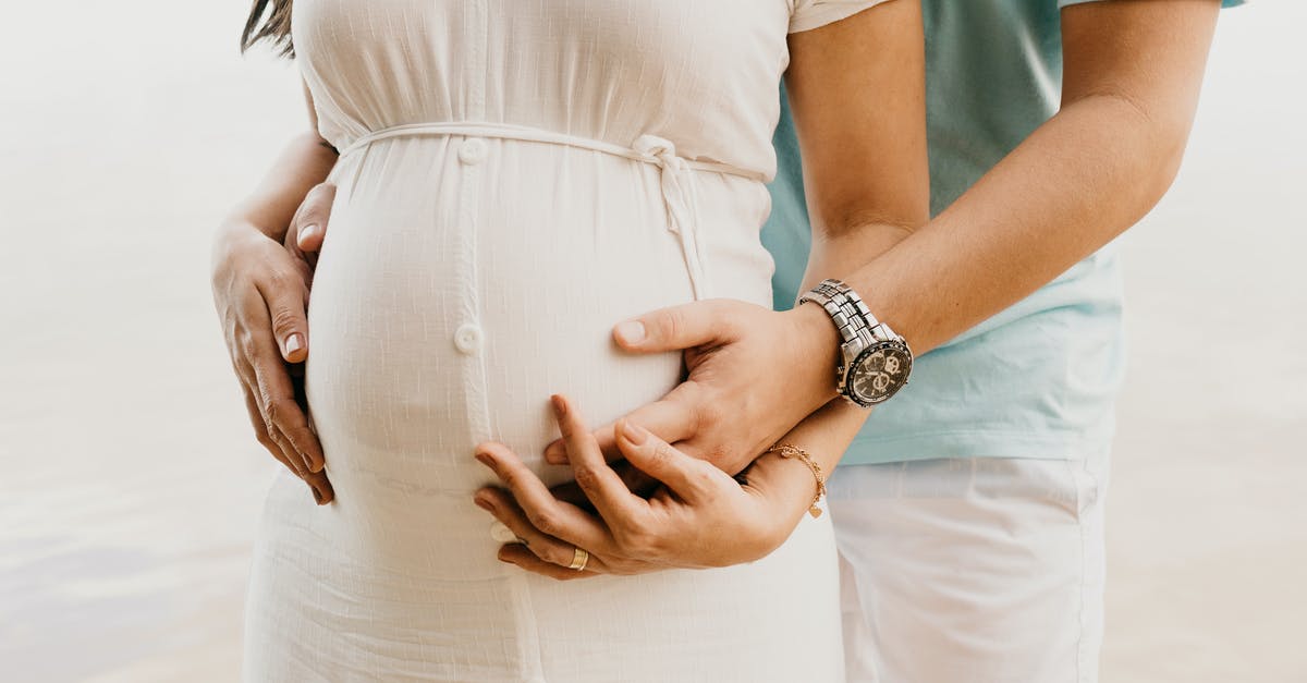 Sous vide pasteurization for pregnant wife - Crop anonymous young man in casual clothes embracing belly of pregnant wife while standing on seashore Sous vide pasteurization for pregnant wife - Crop anonymous young man in casual clothes embracing belly of pregnant wife while standing on seashore