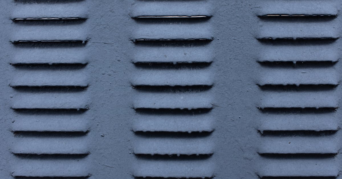 Sous vide timing for prime rib - Background of gray shabby metal construction with symmetrical rows of ribs on surface Sous vide timing for prime rib - Background of gray shabby metal construction with symmetrical rows of ribs on surface