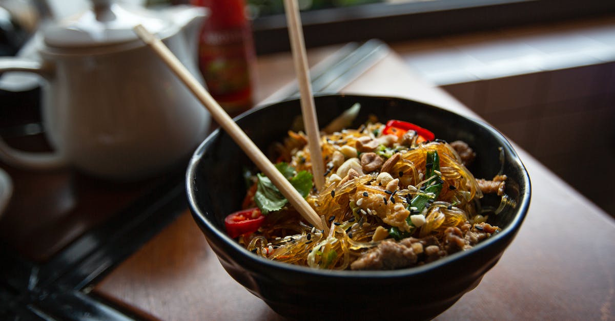 Soy and sesame sauce alternatives when frying fish? - Bowl of delicious noodles with meat and vegetables served on table Soy and sesame sauce alternatives when frying fish? - Bowl of delicious noodles with meat and vegetables served on table