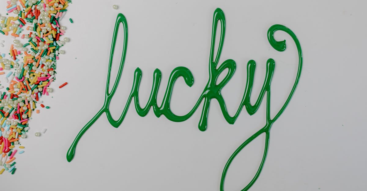 Sprinkle colors that bleed into icing - Green Icing Text on a White Surface Sprinkle colors that bleed into icing - Green Icing Text on a White Surface