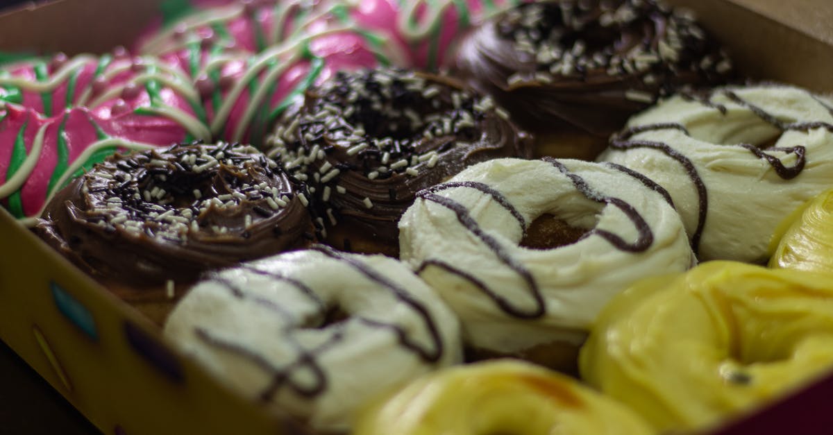 Sprinkle colors that bleed into icing - A Box of Donuts in Different Flavors Sprinkle colors that bleed into icing - A Box of Donuts in Different Flavors