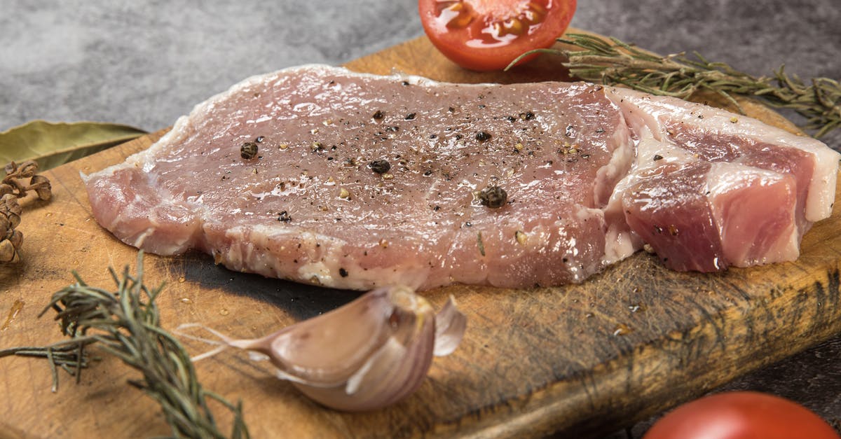 Squishy raw pork - gone bad? - Porkchops on Wooden Chopping Board Squishy raw pork - gone bad? - Porkchops on Wooden Chopping Board