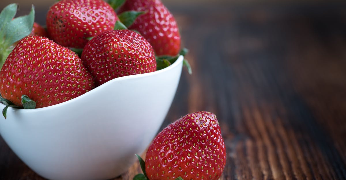 Stablising berry coulis - White Bowl of Whole Strawberries Stablising berry coulis - White Bowl of Whole Strawberries