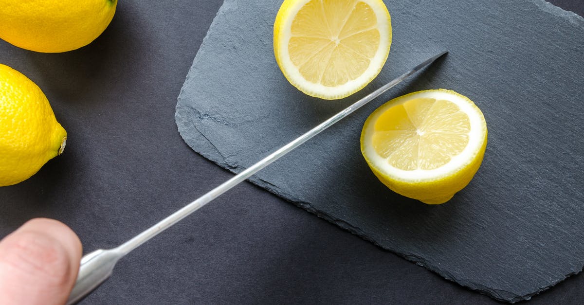 Stained Knife Blade - Photo of Sliced Lemon Stained Knife Blade - Photo of Sliced Lemon