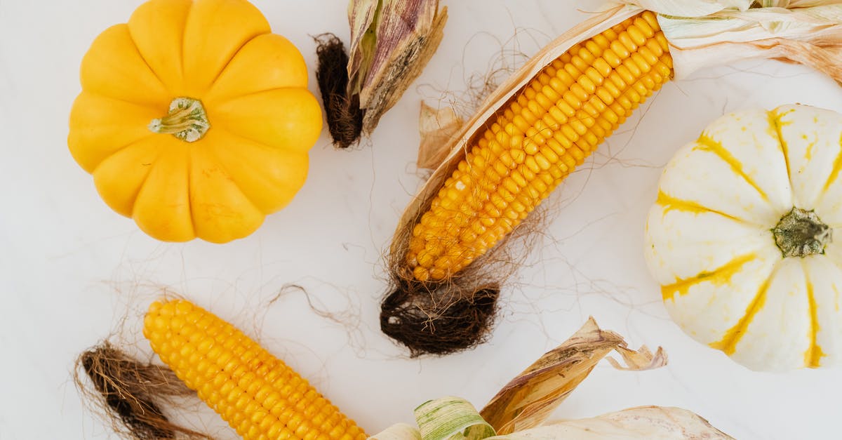 Steaming vegetables in microwave - Close-up of Corn Cobs and Pumpkins Steaming vegetables in microwave - Close-up of Corn Cobs and Pumpkins