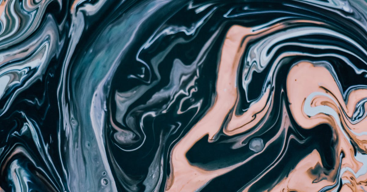 Steaming with oil instead of water - Mix of multicolored paints on surface Steaming with oil instead of water - Mix of multicolored paints on surface