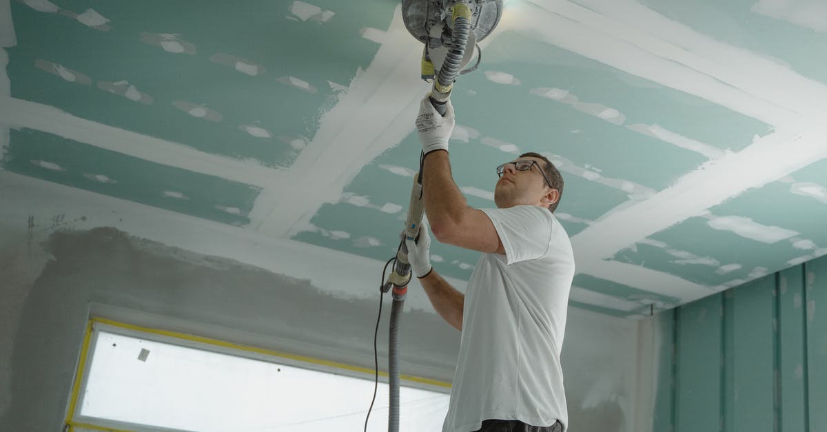 Steel Pan non-stick improvement by polishing - Man Polishing the Ceiling Steel Pan non-stick improvement by polishing - Man Polishing the Ceiling