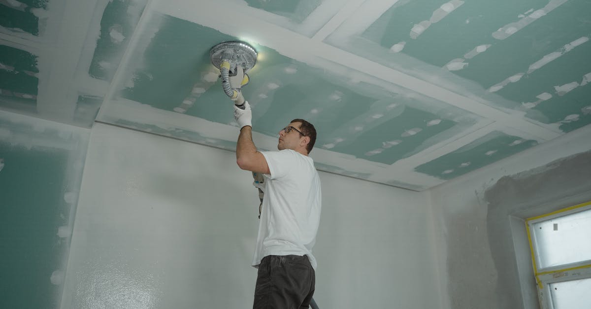 Steel Pan non-stick improvement by polishing - Man Polishing the Ceiling Steel Pan non-stick improvement by polishing - Man Polishing the Ceiling