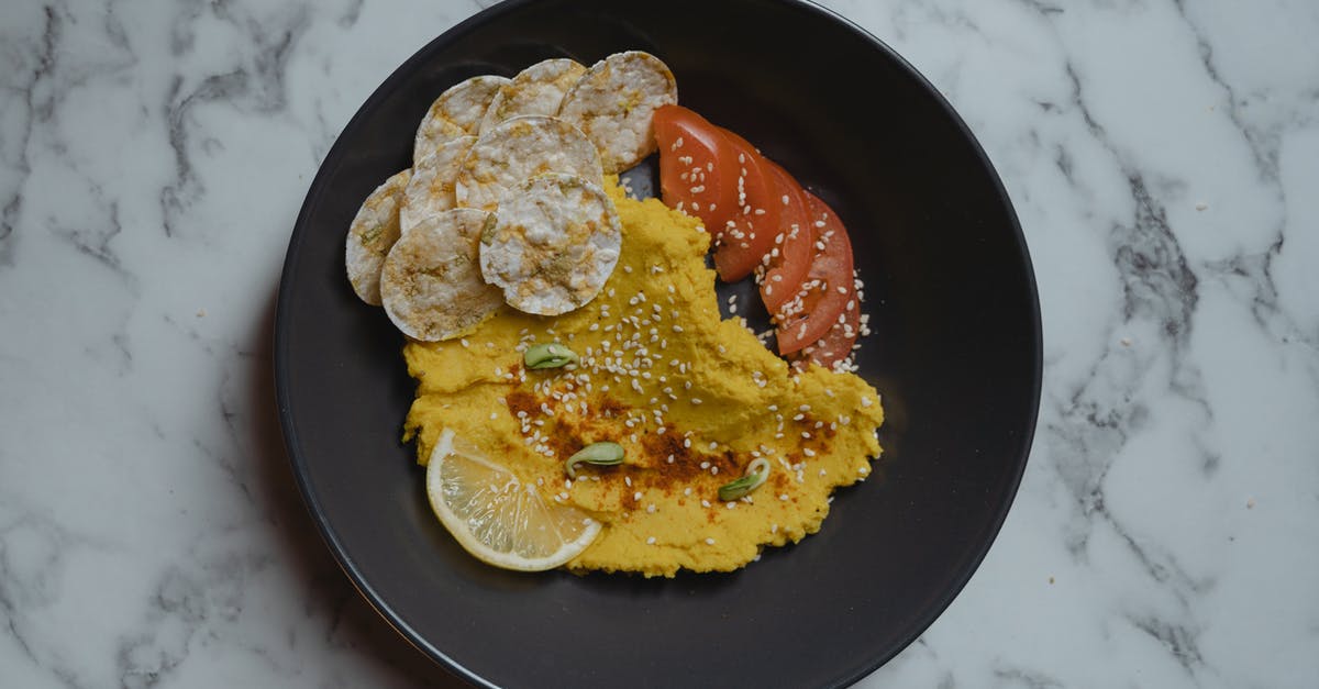 Stop Hummus from darkening - A Hummus with Sliced Tomatoes on the Side Stop Hummus from darkening - A Hummus with Sliced Tomatoes on the Side