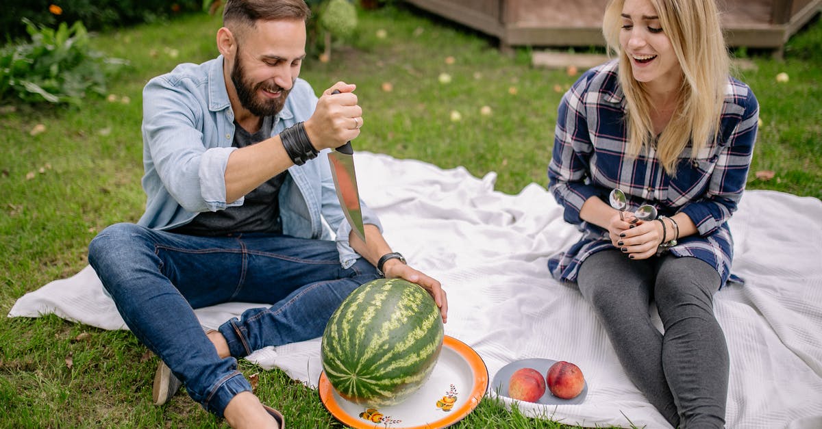 Storing fresh peaches for a long time - A Man Pointing a Sharp Knife on a Watermelon Storing fresh peaches for a long time - A Man Pointing a Sharp Knife on a Watermelon