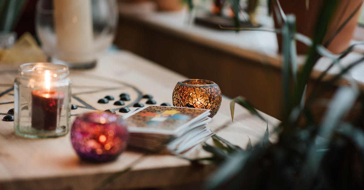 Stuffed peppers that don't burn on to the pot - Luminous candles in holders near tarot cards on table with oracle symbol at home Stuffed peppers that don't burn on to the pot - Luminous candles in holders near tarot cards on table with oracle symbol at home