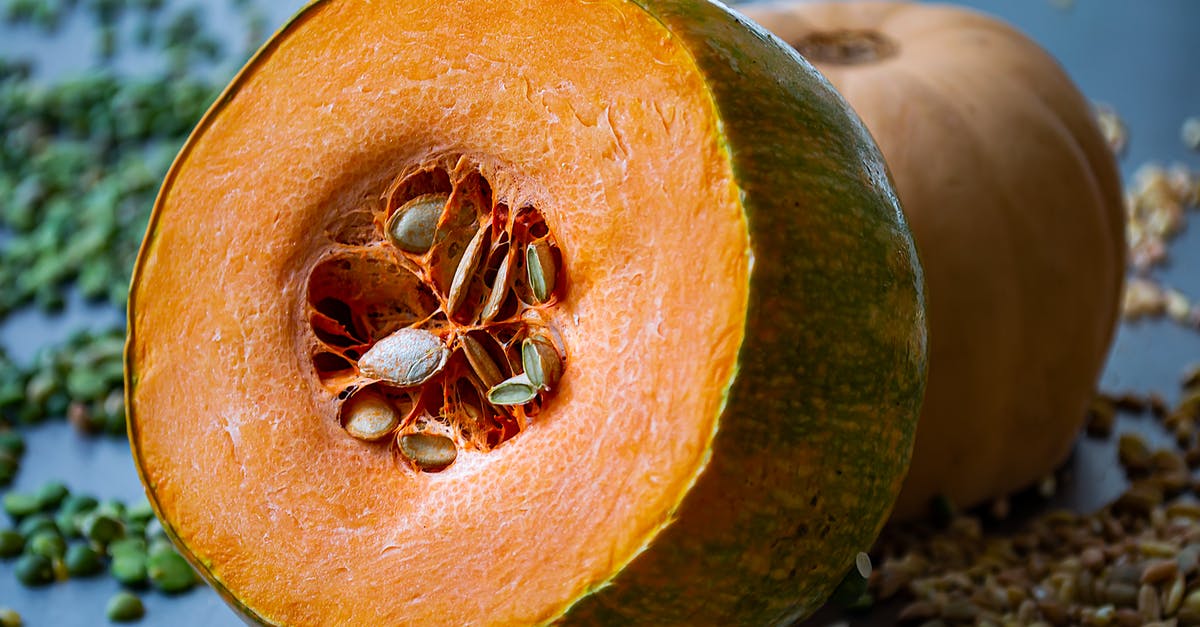 Stuffed pumpkin on a burner - Brown and Black Spider on Yellow and Green Fruit Stuffed pumpkin on a burner - Brown and Black Spider on Yellow and Green Fruit