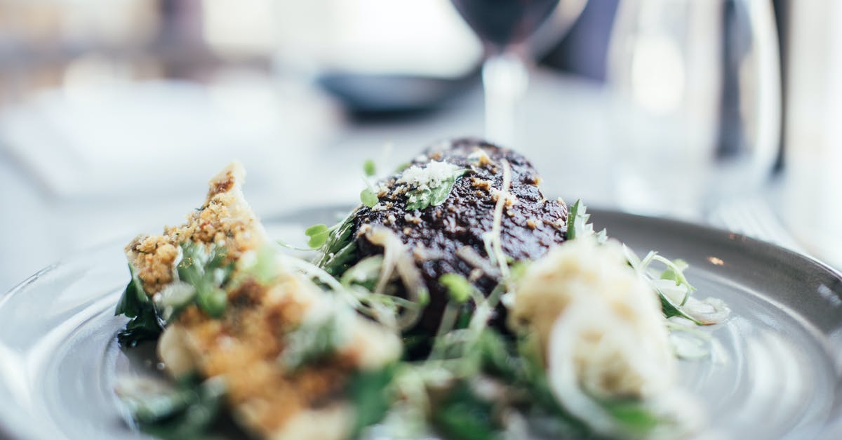 Substitute for celery in Thanksgiving stuffing - Tasty stuffed celery and grilled steak decorated with fresh green herbs served on plate on table in restaurant with wineglass on blurred background