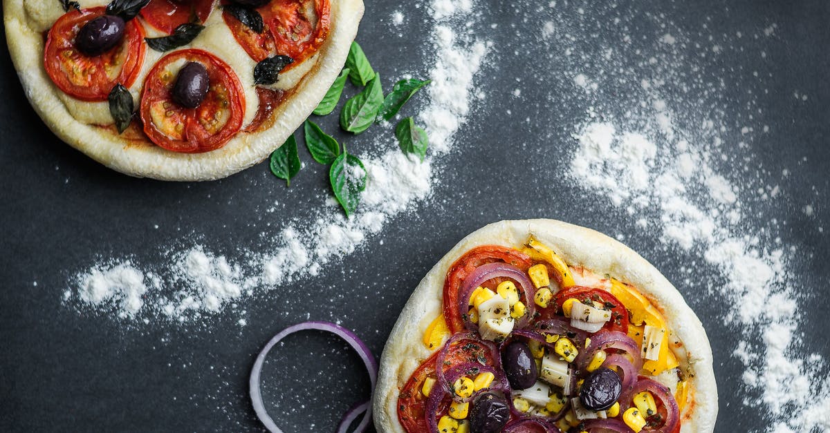 Substitute nixtamalized corn flour for corn meal + corn starch - Pizza with tomatoes and cheese on table with flour Substitute nixtamalized corn flour for corn meal + corn starch - Pizza with tomatoes and cheese on table with flour