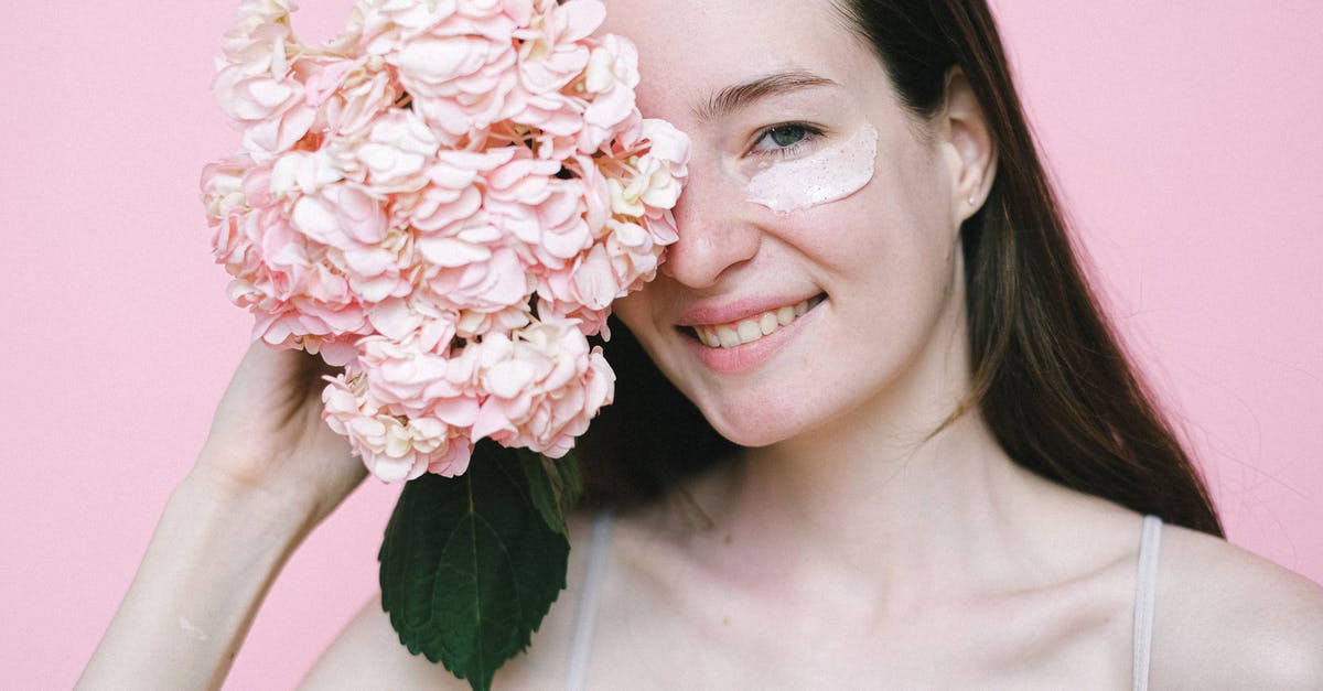 Substituting cream of tartar in turkish delights? - Smiling woman covering eye with pink flower while standing against pink background Substituting cream of tartar in turkish delights? - Smiling woman covering eye with pink flower while standing against pink background